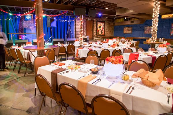 A restaurant with tables and chairs set up for a party